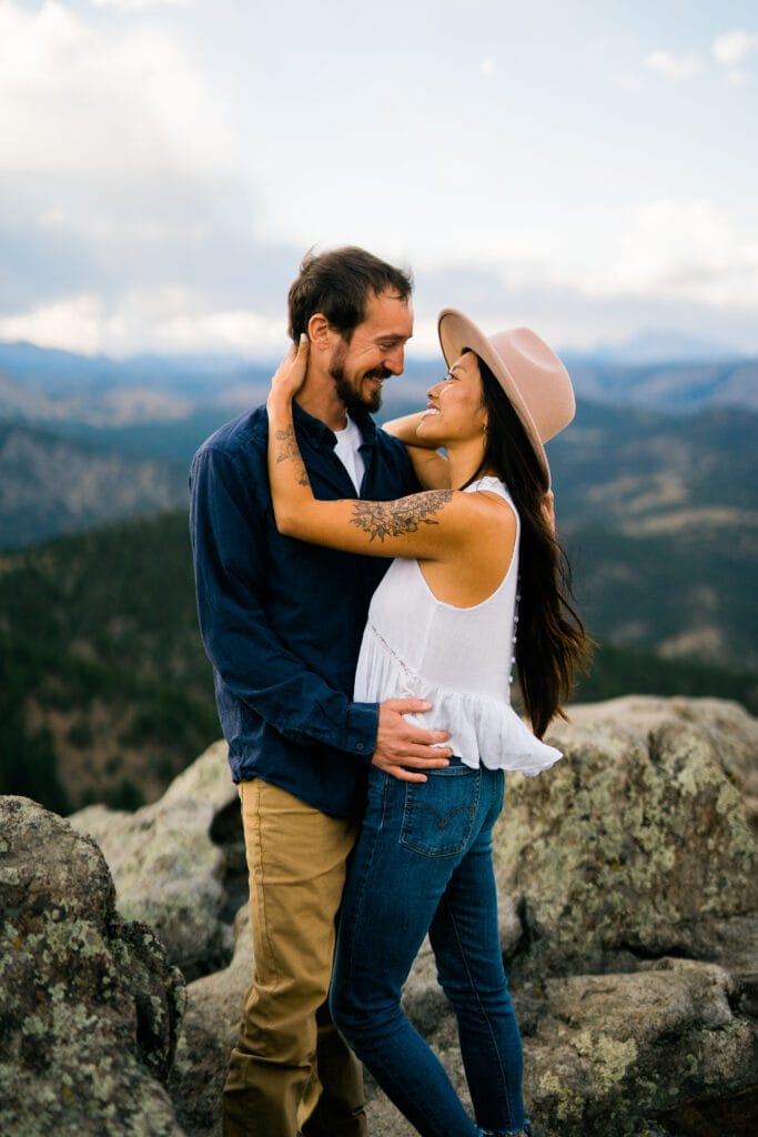 fiancee smiling up at her boyfriend in boulder colorado during their Chautauqua Park Engagement Photos
