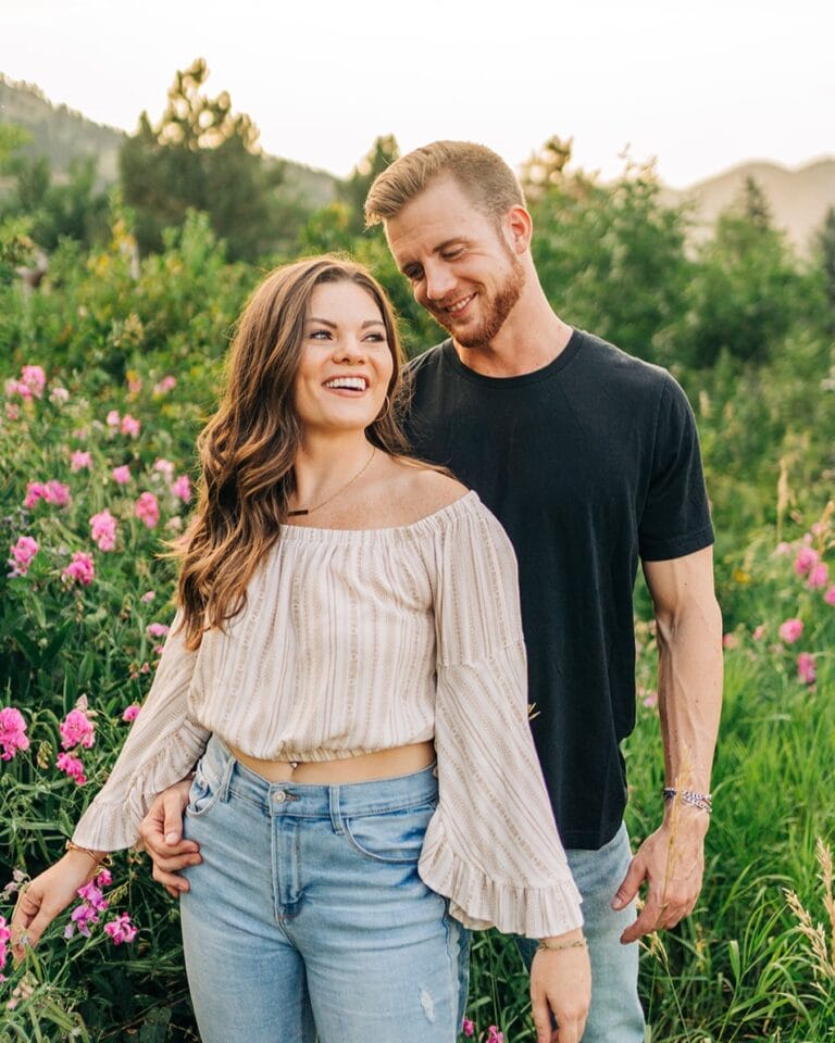 boyfriend looking down at his girlfriend smiling during their boulder colorado couples session at chautauqua park