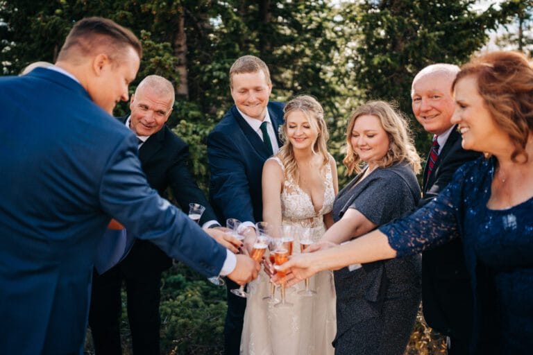 Bride and Groom toasting with their guests after their Breckenridge elopement ceremony