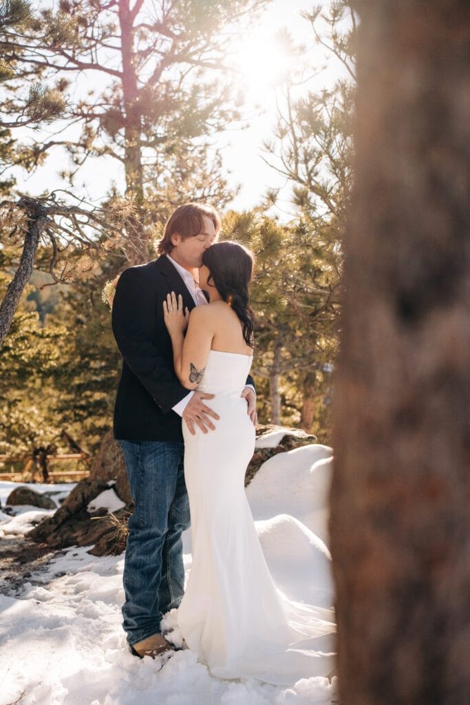 bride and groom kissing during their boulder elppement