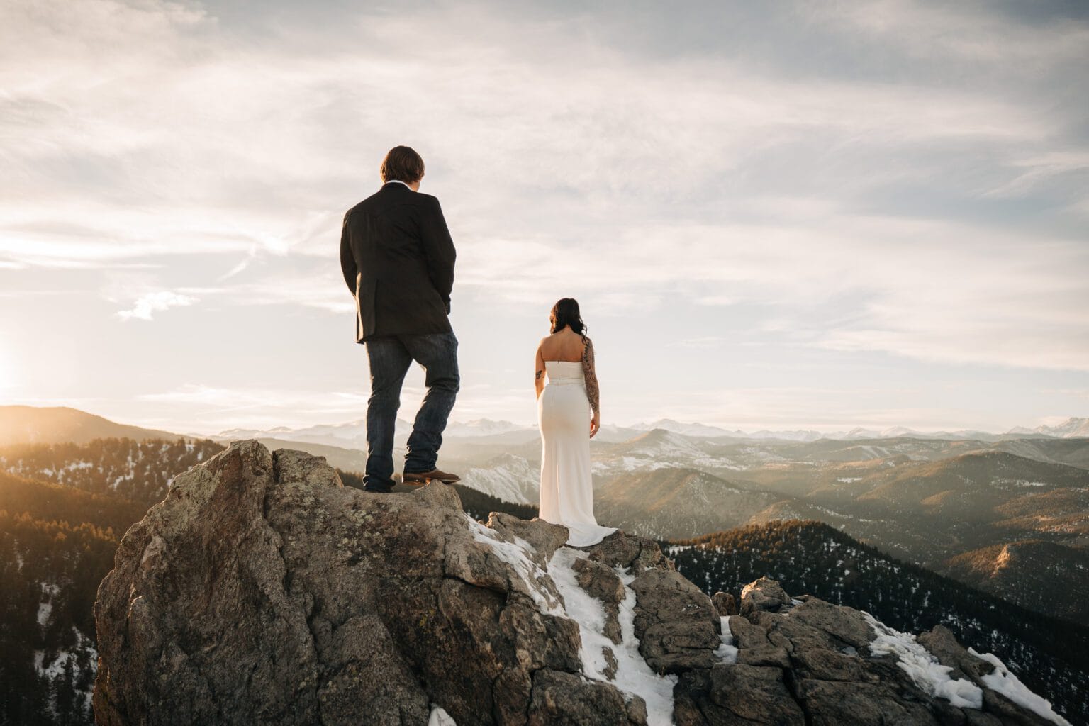 bride and groom standing on top of a mountain at Lost Gulch in Colorado during their boulder elopement