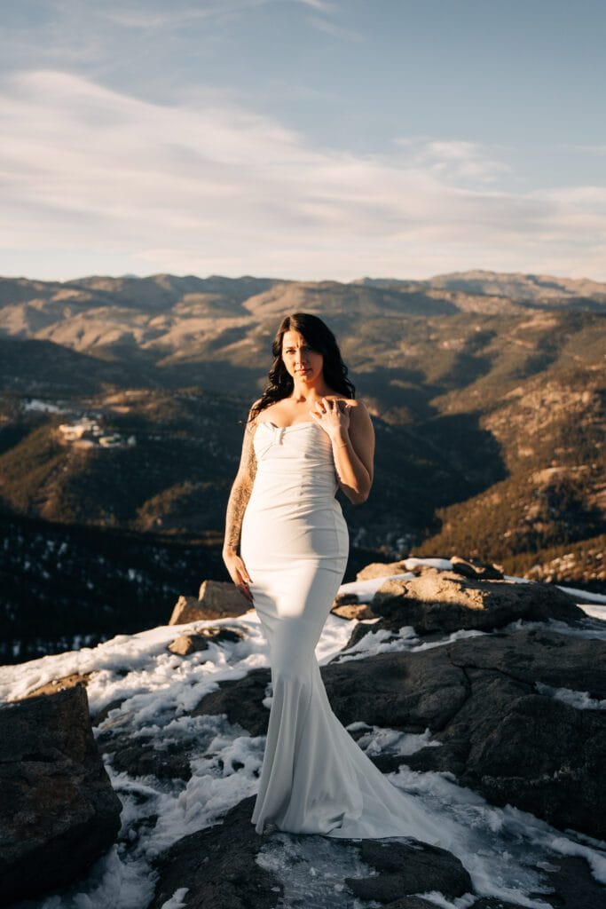 Bride standing on a cliff at Lost Gulch Overlook during her Boulder Elopement in Colorado