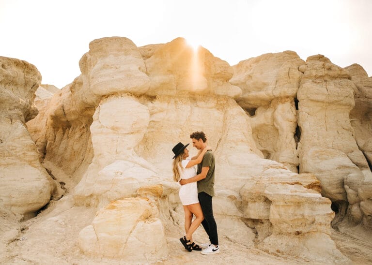 Couple embracing at the Colorado Paint Mines at sunset.