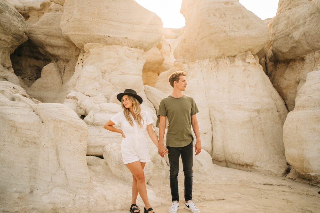 Couple holding hands and looking in different directions at the Colorado Paint Mines