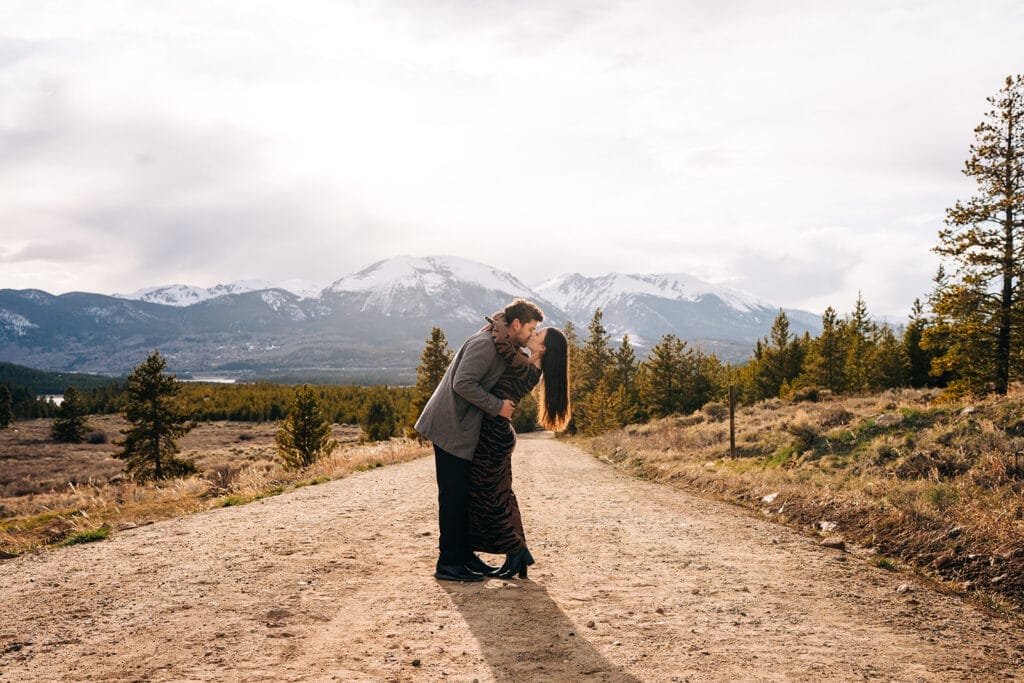 Eric kissing Chelsea and dipping her during their proposal photos at Sapphire Point Overlook in Breckenridge, Colorado