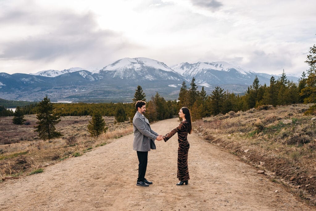 Couple holding hands on mountain path at sapphire point overlook