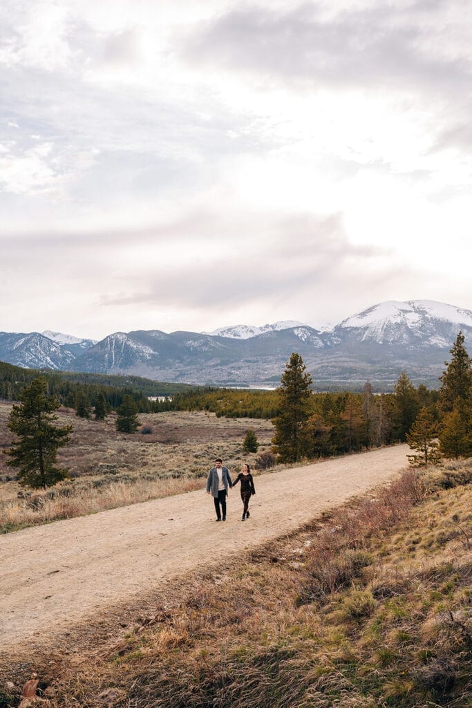 Eric and Chelsea walking down a road at Sapphire Point Overlook
