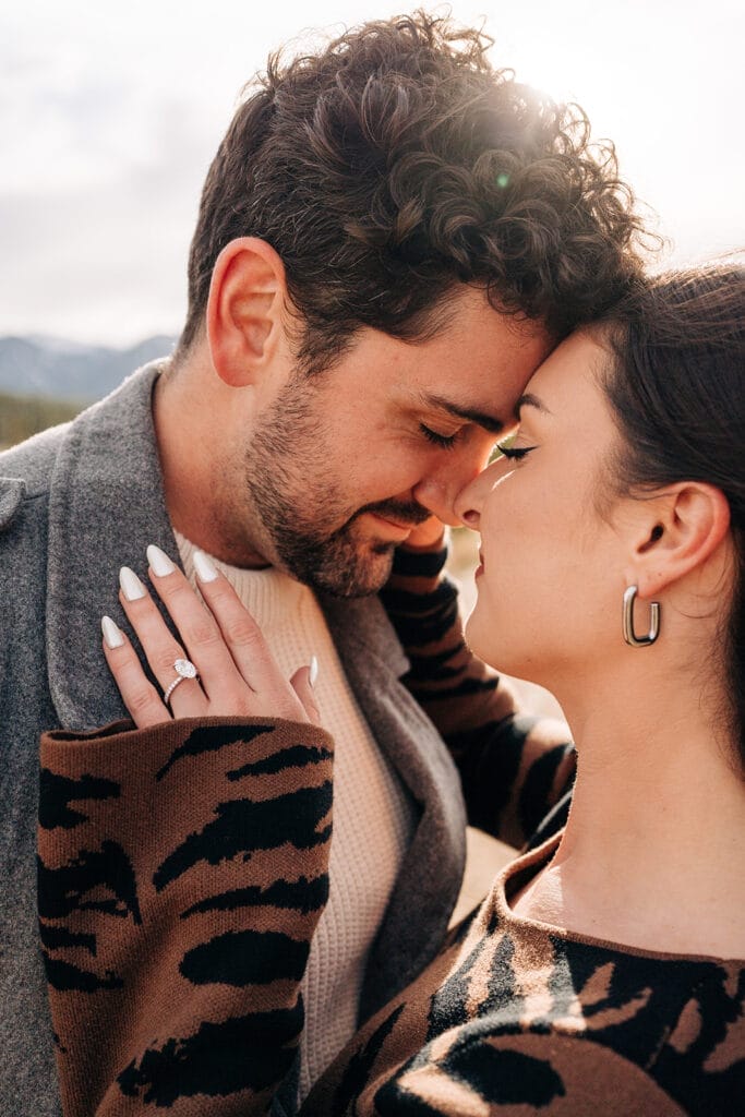Close-up of couple with engagement ring at sapphire Point overlook