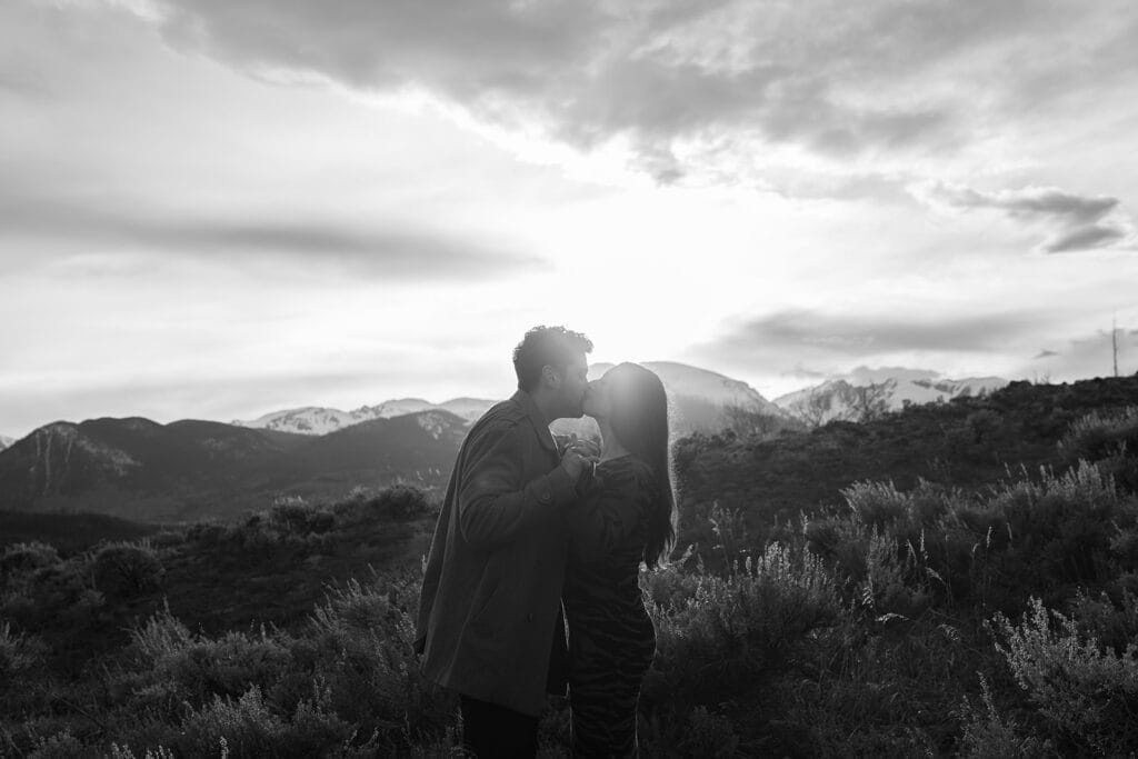 Couple kissing at Sapphire Point Overlook at sunset